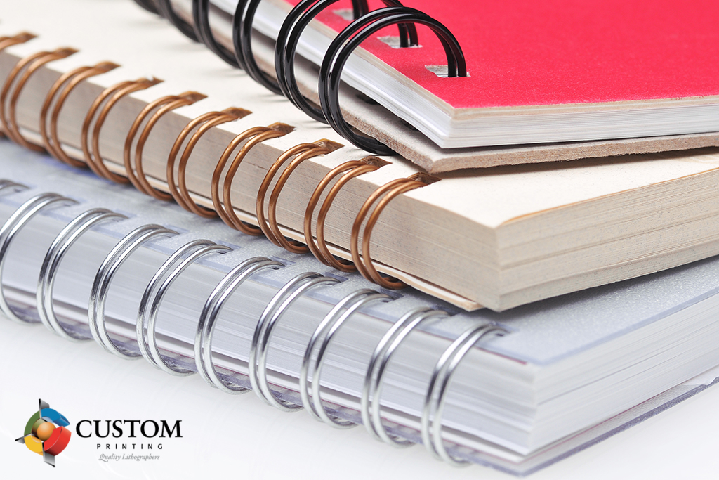 Different colors of spiral bound books